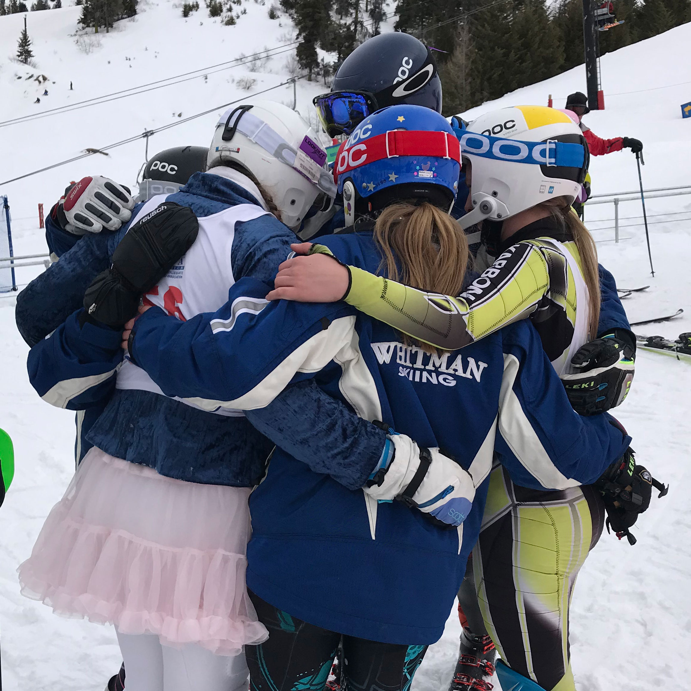 Whitman's Alpine Ski Team hugs before a race